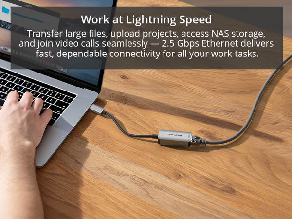 A Man Is Working and Transferring Files on MacBook Pro via USB-C to Ethernet adapter