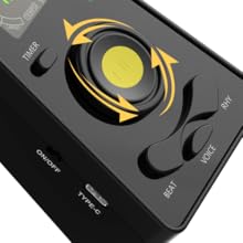 Black electronic device with circular yellow control pad showing rotation arrows, multiple buttons, and type-c port on front panel.