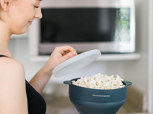 Microwave popcorn maker with a microwave in the background