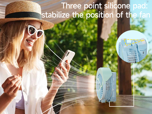 Portable fan with three-point silicone pad for stability. Woman outdoors using smartphone, with fan visible in inset image.