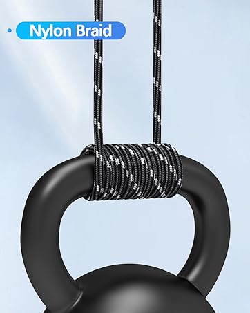 Black ring-shaped fitness handle suspended by black and white braided nylon ropes. Text 'Nylon Braid' visible. Handle appears suitable for strength training or gymnastics exercises.