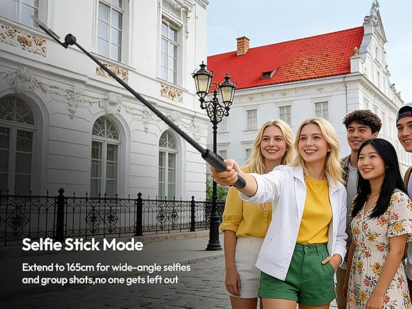 Group photo scene in front of historic building with red roof, demonstrating outdoor photography with mobile device mount.