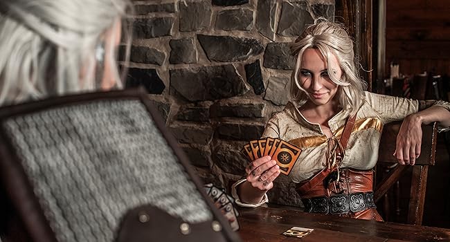 Photo of Witcher cosplayers playing Gwent