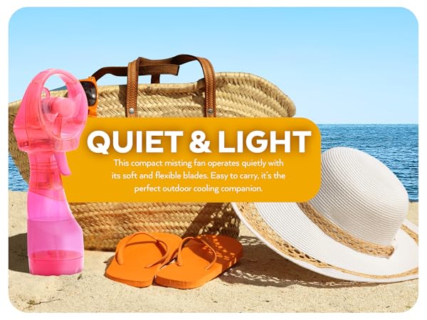 O2Cool Pink Deluxe Misting Fan on Beach