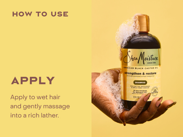 Image of hands holding a shampoo bottle with product.