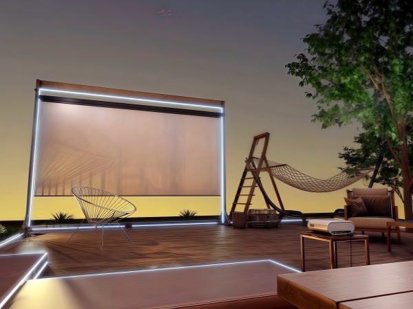 Outdoor evening patio setup with retractable projection screen, wooden deck furniture, and hammock against sunset sky. Ambient lighting creates cozy atmosphere.
