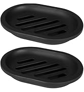 Multiple black textured heating plates or warmers with raised parallel ridges, shown from different angles against white background