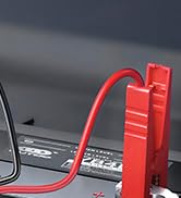 a red cable is connected to a laptop.