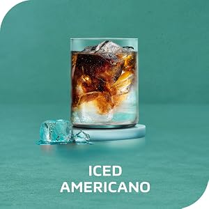A clear, swirling glass of NESCAFÈ Espresso Concentrate, water and ice. Tagline: Iced Americano.