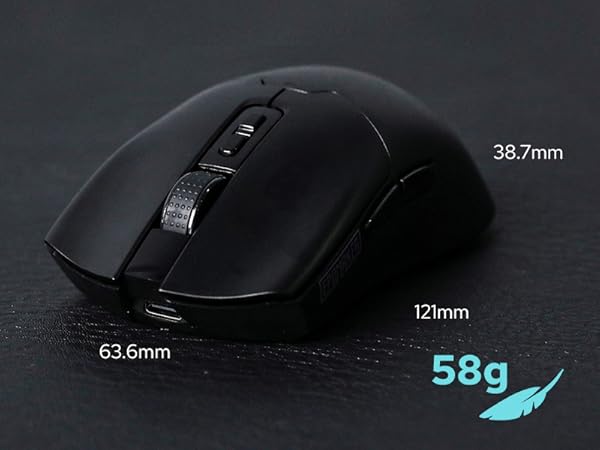 Wireless computer mouse in matte black. Ergonomic design with side buttons. Dimensions: 121mm length, 63.6mm width, 38.7mm height. Weighs 58g. Textured scroll wheel visible.