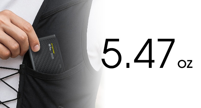 A person putting the NB Plus into their workout vest pocket