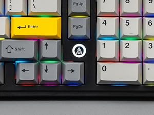 Close-up view of a computer keyboard showing colorful keycaps with various function keys and arrows visible.