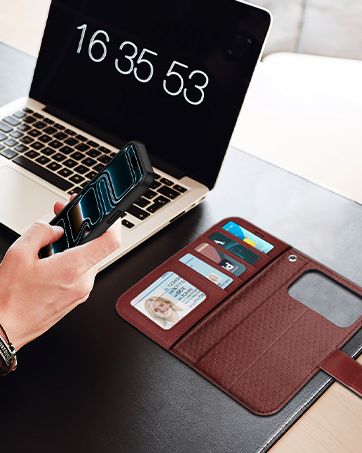 Series of images showing a brown leather desk pad or mat being used with a laptop, featuring built-in device holder and workspace organization functionality.