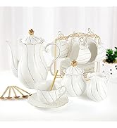 Elegant white porcelain tea set with gold accents. Includes teapot, cups, saucers, sugar bowl, and creamer. Fluted design with curved edges and gold-topped lids.