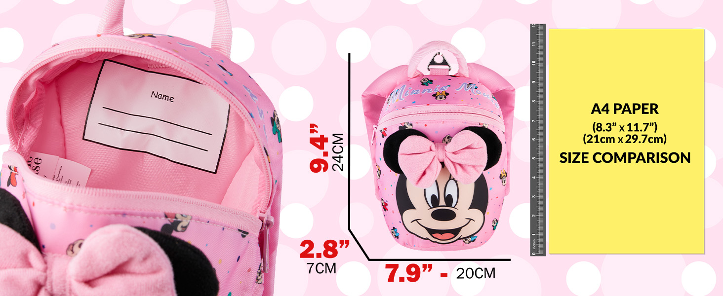 Pink backpack with Minnie Mouse design showing measurements: 7.9 inches width and dimensional specifications. Features name tag holder and cartoon character detailing.