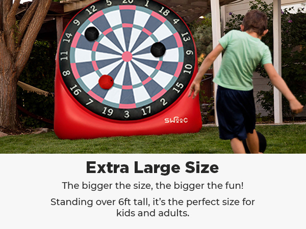 Swooc games for people that do it big. Boy about to kick kickballs at giant dartboard.