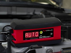 Car battery charger and maintainer has quick-connect harness for fast hook up of two connectors.