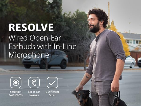 Man wearing Avantree resolve-c while walking dog.