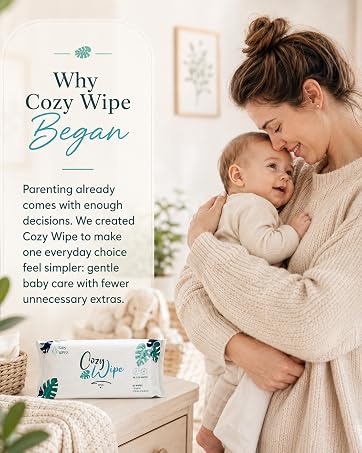 Mother holding baby beside Cozy Wipe baby wipes in a bright nursery.