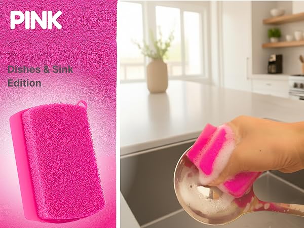 Pink silicone sponge washing spoon with rich foam in kitchen sink