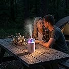 Mini diffuser with colorful light on a camping table – perfect for romantic outdoor evenings