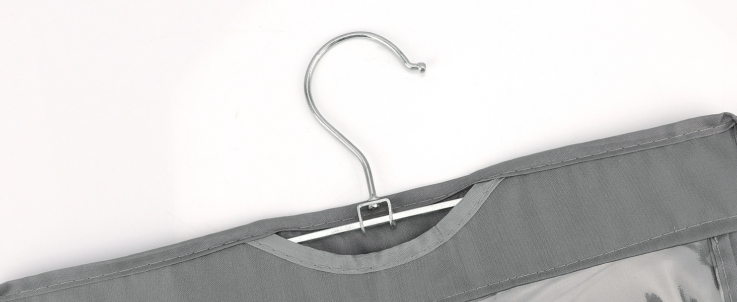 Close-up of a metal clothing hanger with a curved hook and a gray fabric-covered section visible on the hanger's shoulder area.