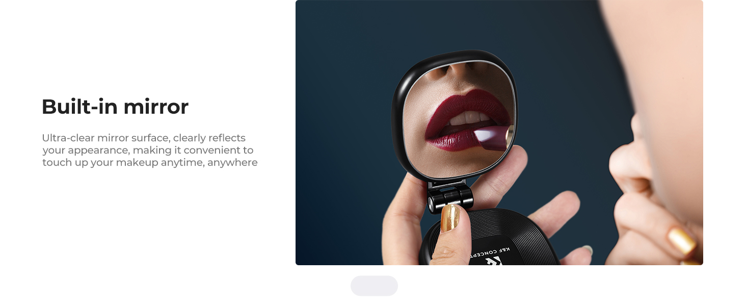 Text reads 'Built-in mirror'. Product demonstration showing compact mirror feature integrated into a dark-colored device.
