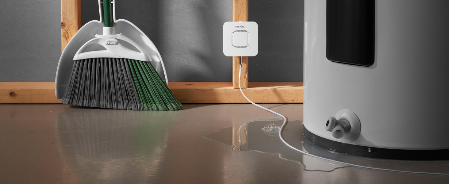 RWD42 Water Leak Detector mounted on wall next to leaking water heater