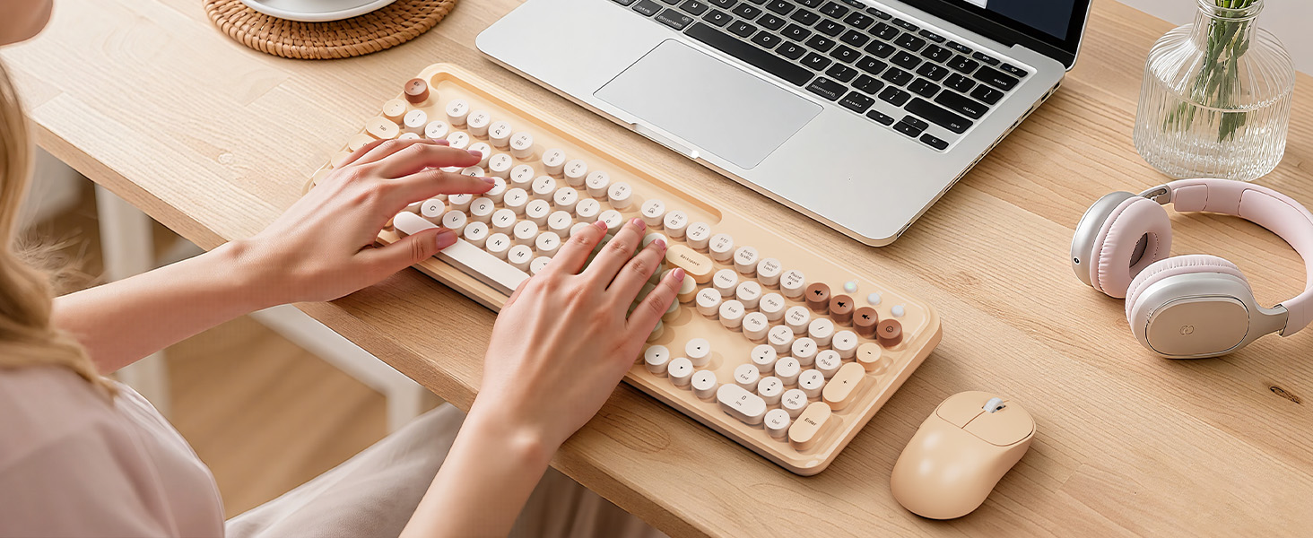 Stylish wireless keyboard and mouse brighten a cozy home workspace, keeping typing smooth