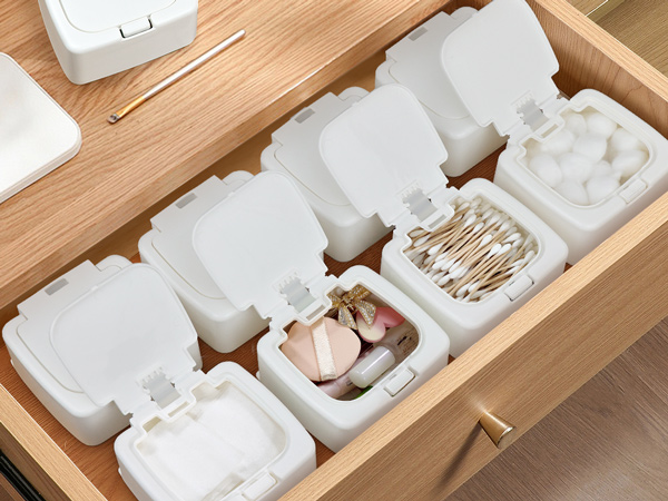 Push-button storage box