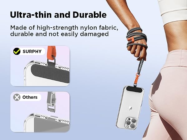 Ultra-thin, durable phone strap made of high-strength nylon fabric. Comparison shows product's slim profile against competitor. Hand demonstrates strap supporting smartphone weight.