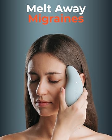 person placing the hand held massager on their head with their eyes closed relaxing