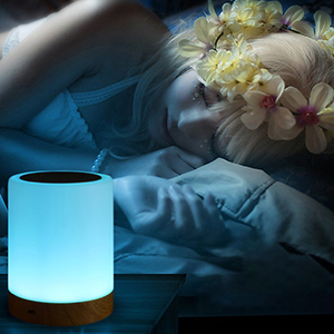 Peacefully sleeping girl with night light