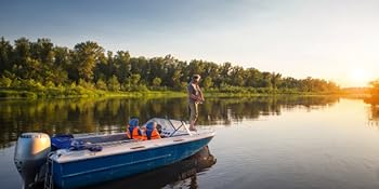 A fisherman stands in the boat