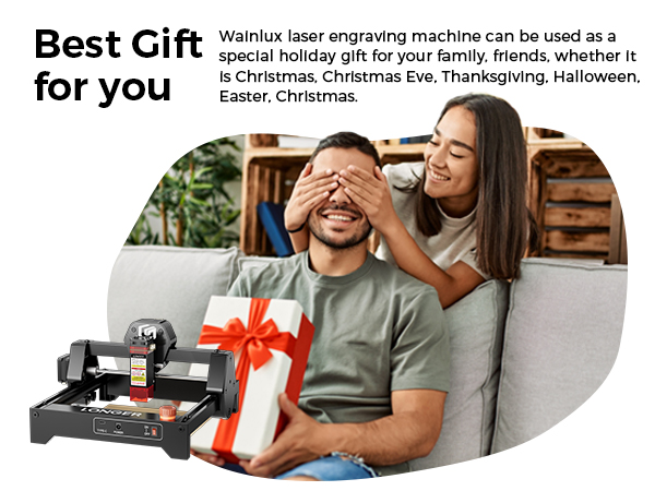 Wainlux laser engraving machine shown as a gift. Black device with red accents. Text suggests it's suitable for various holidays. Image includes couple with woman surprising man with present.