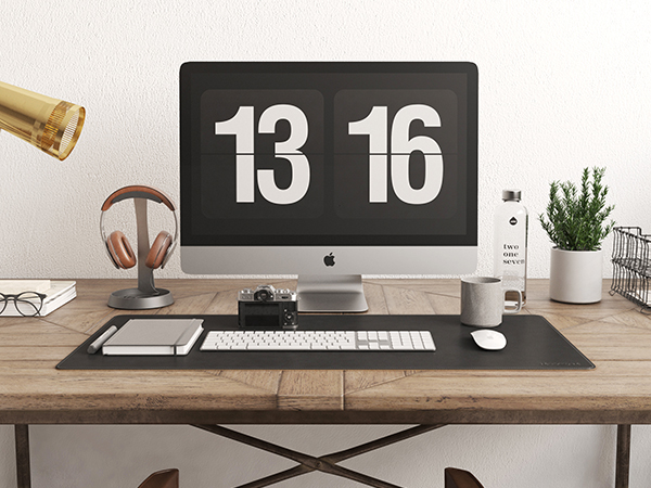 a large leather black mouse pad on the wood office desk, mouse pad for mouse and key board