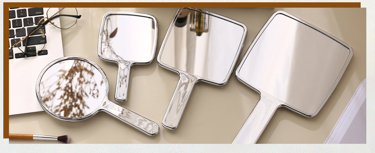 handheld mirror with held