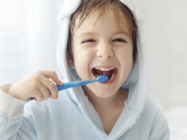 kid brushing teeth