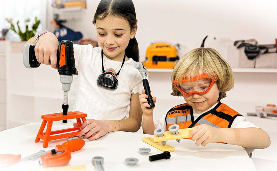 Two children engaged in a construction activity. Girl operating a power drill on orange object, boy wearing safety goggles examining yellow tool.