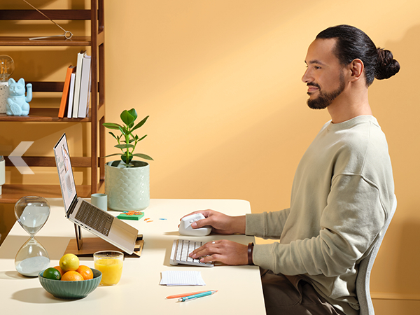 A man working on a computer using Lift for Mac