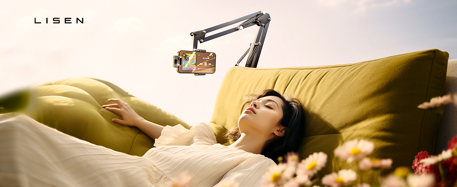 Adjustable phone mount arm attached near yellow couch, designed for overhead viewing while resting.