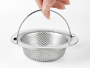 Stainless steel colander with perforated design and folding handle. Compact strainer basket with metal construction and swing-up carrying handle.