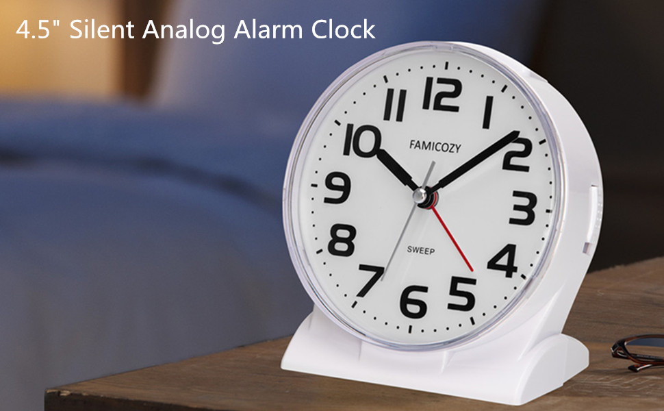 922 white clock on bedside table