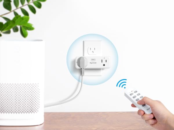 a hand-using remote control outlet plug to manage home appliances like air humidifier