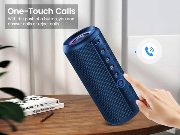 Text reads 'One-Touch Calls with the push of a button you can'. Blue cylindrical wireless speaker with control buttons shown on wooden surface, demonstrating one-touch calling feature.