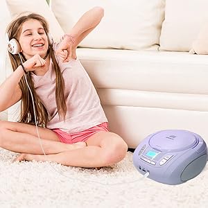 cd player with headphone purple