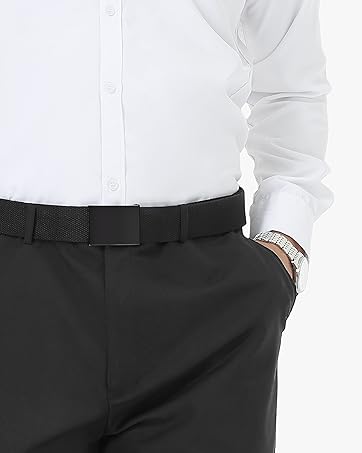 Close-up of a person's lower torso wearing black dress pants, a white dress shirt, and a black belt. A watch is visible on the wrist.