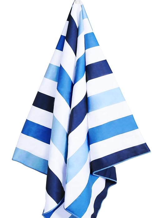 Blue and white striped beach towels in various sizes. Compact travel-sized towel in mesh bag labeled 'Cabana'.