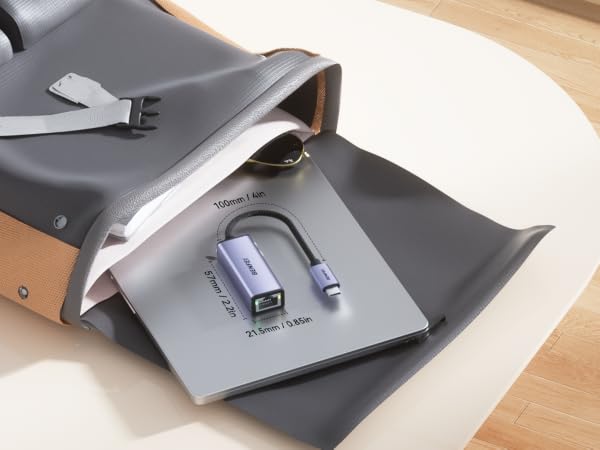 Continuation of gray electronic device images showing additional angles and details of the same product on wooden surface.