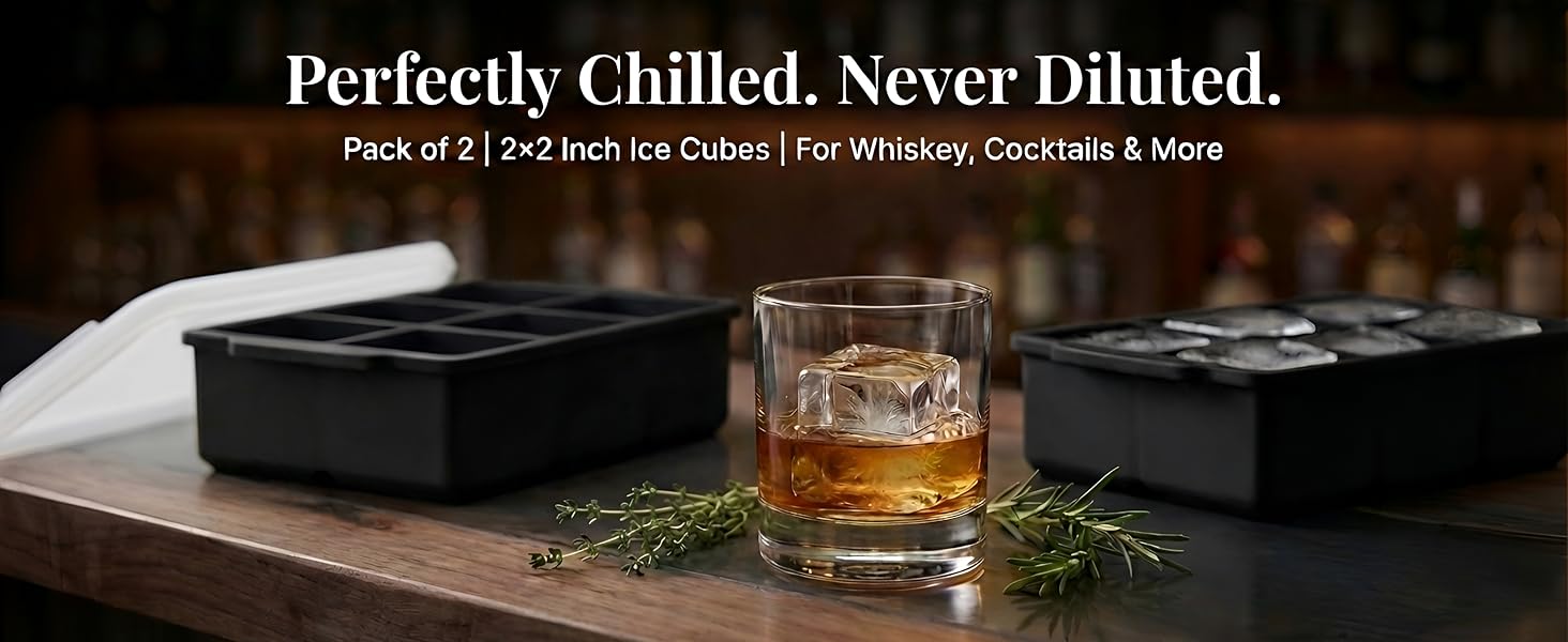 2 ice trays with ice cubes and a glass of whiskey